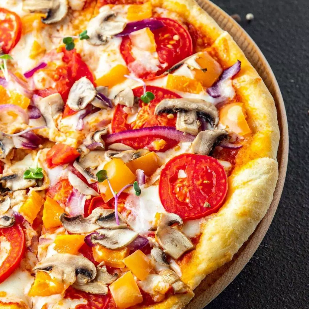 Pizza artisanale cuite à la perfection avec des ingrédients frais chez Luigia, votre pizzeria à Sion.